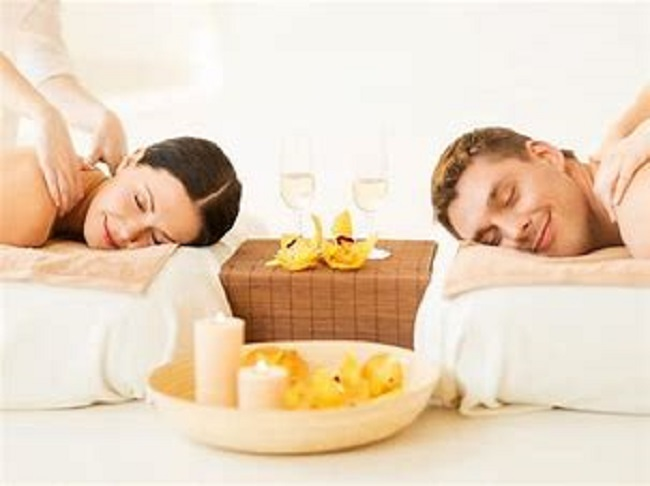 Picture of man and woman receive a nice couples massage together.